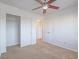 Bedroom features closet, ceiling fan, and neutral colored carpet at 5929 Sleepy Fawn Dr, Las Vegas, NV 89142