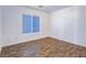 Neutral-toned bedroom offers hardwood floors, natural light, and a spacious layout at 5929 Sleepy Fawn Dr, Las Vegas, NV 89142