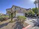 Two-story home with a two-car garage and desert landscaping at 5929 Sleepy Fawn Dr, Las Vegas, NV 89142