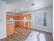 Charming kitchen features wood cabinets, a white gas stove, and light hardwood flooring at 5929 Sleepy Fawn Dr, Las Vegas, NV 89142