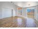 Bright living room boasts light hardwood floors, a large window, and sliding glass door to a backyard at 5929 Sleepy Fawn Dr, Las Vegas, NV 89142