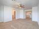 Spacious main bedroom with ceiling fan, carpet, and en suite bathroom at 5929 Sleepy Fawn Dr, Las Vegas, NV 89142
