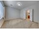 Spacious bedroom featuring neutral walls, carpet flooring, and an ensuite bathroom at 6116 Tokara Ave, Las Vegas, NV 89122