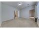 Spacious bedroom with neutral walls, carpet flooring, and access to ensuite bathroom at 6116 Tokara Ave, Las Vegas, NV 89122