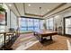 Bright game room with pool table and comfortable seating overlooking the pool at 6116 Tokara Ave, Las Vegas, NV 89122