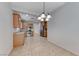 Open kitchen and dining area with stainless steel appliances and ample cabinetry at 6116 Tokara Ave, Las Vegas, NV 89122