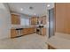 Kitchen features stainless steel appliances and wood cabinets at 6116 Tokara Ave, Las Vegas, NV 89122