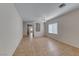 Bright, open living room features tile floors and neutral walls at 6116 Tokara Ave, Las Vegas, NV 89122