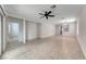 Open living space with cool tile flooring, neutral walls, and access to additional rooms and back yard at 6116 Tokara Ave, Las Vegas, NV 89122