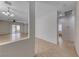 Spacious living area featuring tile flooring, neutral walls, and lots of natural light from sliding glass doors at 6116 Tokara Ave, Las Vegas, NV 89122