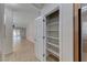 Bright, open pantry with white shelving units for ample storage space at 6116 Tokara Ave, Las Vegas, NV 89122