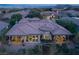 Stunning aerial view showcasing the home, pool, and well-manicured backyard at 64 Tapadero Ln, Las Vegas, NV 89135