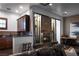 Inviting living room with a fireplace, bar area, and comfortable furniture at 64 Tapadero Ln, Las Vegas, NV 89135