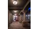 Covered outdoor patio featuring stone columns, tile flooring, and an inviting atmosphere at 64 Tapadero Ln, Las Vegas, NV 89135