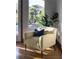 Cozy sitting area with great view, light wood floors, and comfortable armchair at 64 Tapadero Ln, Las Vegas, NV 89135