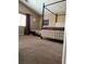Spacious bedroom with a four-poster bed, plush carpeting, and natural light at 6495 Chettle House Ln, Las Vegas, NV 89122