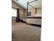 Spacious bedroom with a four-poster bed, plush carpeting, and natural light at 6495 Chettle House Ln, Las Vegas, NV 89122