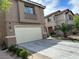 Charming two-story home with a two car garage and well-manicured landscaping at 6495 Chettle House Ln, Las Vegas, NV 89122