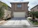 Charming two-story home featuring a spacious two car garage and well-maintained landscaping at 6495 Chettle House Ln, Las Vegas, NV 89122