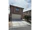 Charming two-story home with a two car garage and well-manicured landscaping at 6495 Chettle House Ln, Las Vegas, NV 89122