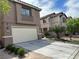 Charming two-story home with a two car garage and well-manicured landscaping at 6495 Chettle House Ln, Las Vegas, NV 89122