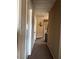 View of the upstairs hallway with neutral walls and carpeted floor at 6495 Chettle House Ln, Las Vegas, NV 89122