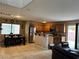 Open-concept kitchen and dining area featuring natural light and stainless steel appliances at 6495 Chettle House Ln, Las Vegas, NV 89122