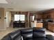 Open-concept living and dining area featuring natural light and stainless steel appliances at 6495 Chettle House Ln, Las Vegas, NV 89122