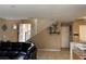 Spacious living room adjacent to the staircase with an open floor plan at 6495 Chettle House Ln, Las Vegas, NV 89122