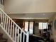 Living room with staircase and an open floor plan at 6495 Chettle House Ln, Las Vegas, NV 89122