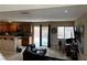 Open living space with tile floors and access to the outdoor patio at 6495 Chettle House Ln, Las Vegas, NV 89122