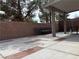Charming covered patio with brick accents and ample seating at 6495 Chettle House Ln, Las Vegas, NV 89122