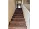 Carpeted staircase with white railing leading to the upper level, providing safe access to the home's second story at 6495 Chettle House Ln, Las Vegas, NV 89122