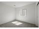 Bright bedroom features a large window, neutral walls, carpet floors, and a closet at 6760 Violet Cascade Ave, Las Vegas, NV 89156