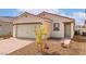 Beautiful single-story home with a two-car garage and desert landscaping at 6760 Violet Cascade Ave, Las Vegas, NV 89156