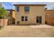 Private backyard with a brick patio and low-maintenance gravel landscaping at 7011 Overton St, Las Vegas, NV 89166