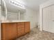 Clean bathroom featuring a single sink vanity, linoleum flooring, and a tub/shower combo at 7011 Overton St, Las Vegas, NV 89166
