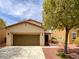 Charming single-story home with a well-maintained lawn, two-car garage, and welcoming curb appeal at 7011 Overton St, Las Vegas, NV 89166