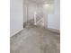 Upstairs hallway featuring neutral carpet, white walls, white doors, and white banister at 7011 Overton St, Las Vegas, NV 89166