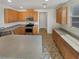 Well-lit kitchen featuring light-colored cabinets, stainless steel appliances, and ample counter space at 7011 Overton St, Las Vegas, NV 89166