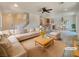 Bright and airy living room featuring an open floor plan, neutral decor, and lots of natural light at 7011 Overton St, Las Vegas, NV 89166