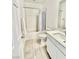 Bathroom with tub-shower, a tile floor and single sink vanity at 7041 Fossil Rim St, North Las Vegas, NV 89084