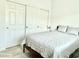 Cozy bedroom with a closet, soft carpet, and a comfy bed at 7041 Fossil Rim St, North Las Vegas, NV 89084