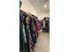 Walk-in closet with built in shelving and rods for optimal storage at 7041 Fossil Rim St, North Las Vegas, NV 89084