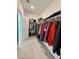 Spacious walk-in closet with carpeting and shelving units for ample storage at 7041 Fossil Rim St, North Las Vegas, NV 89084