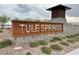 Tule Springs community sign with landscaping and a stone structure in the background at 7041 Fossil Rim St, North Las Vegas, NV 89084