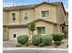 Inviting two-story home featuring a two-car garage, landscaped front yard, and neutral stucco exterior at 7041 Fossil Rim St, North Las Vegas, NV 89084