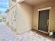 Inviting home entrance with a decorative front door and beautiful brick walkway for added curb appeal at 7041 Fossil Rim St, North Las Vegas, NV 89084