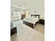 Comfortable main bedroom with neutral carpet, ensuite bath, and natural light at 7041 Fossil Rim St, North Las Vegas, NV 89084