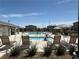 Relaxing community pool area with lounge chairs and well-maintained landscaping at 7041 Fossil Rim St, North Las Vegas, NV 89084